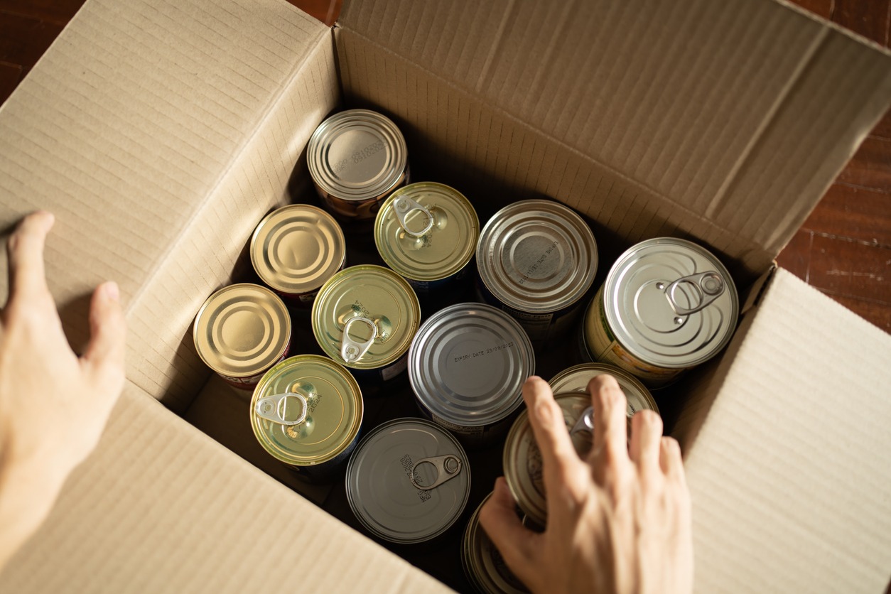 Storing canned foods in a cardboard box