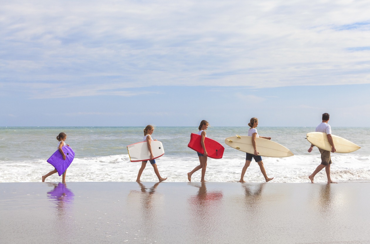 Family Parents Girl Children Surfboards on Beach