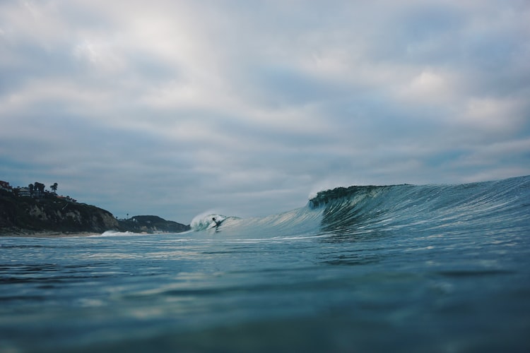 person-surfing-on-a-beach-break-wave