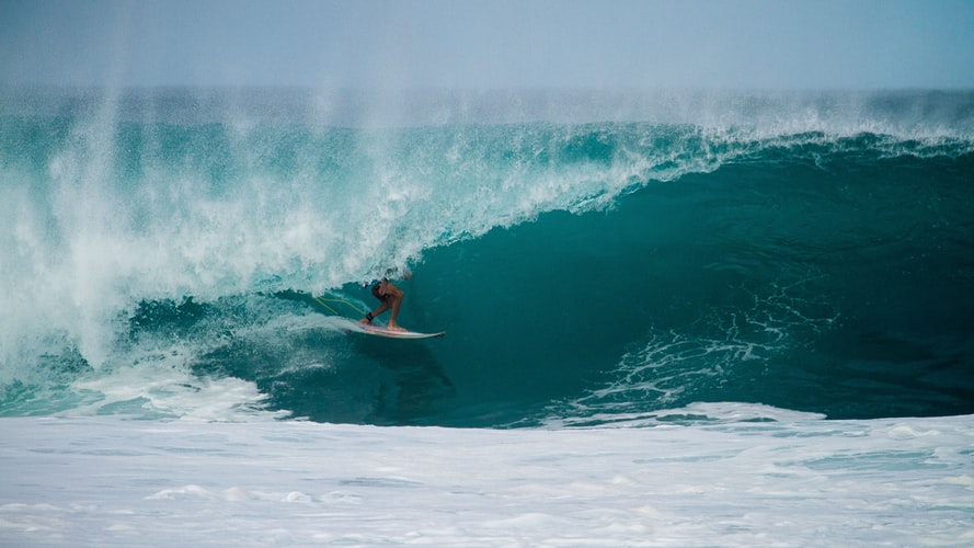 person-surfing-on-a-point-break-surfing-wave