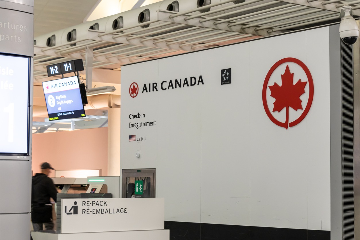 Air Canada logo on a check-in counter inside Toronto Pearson Airport