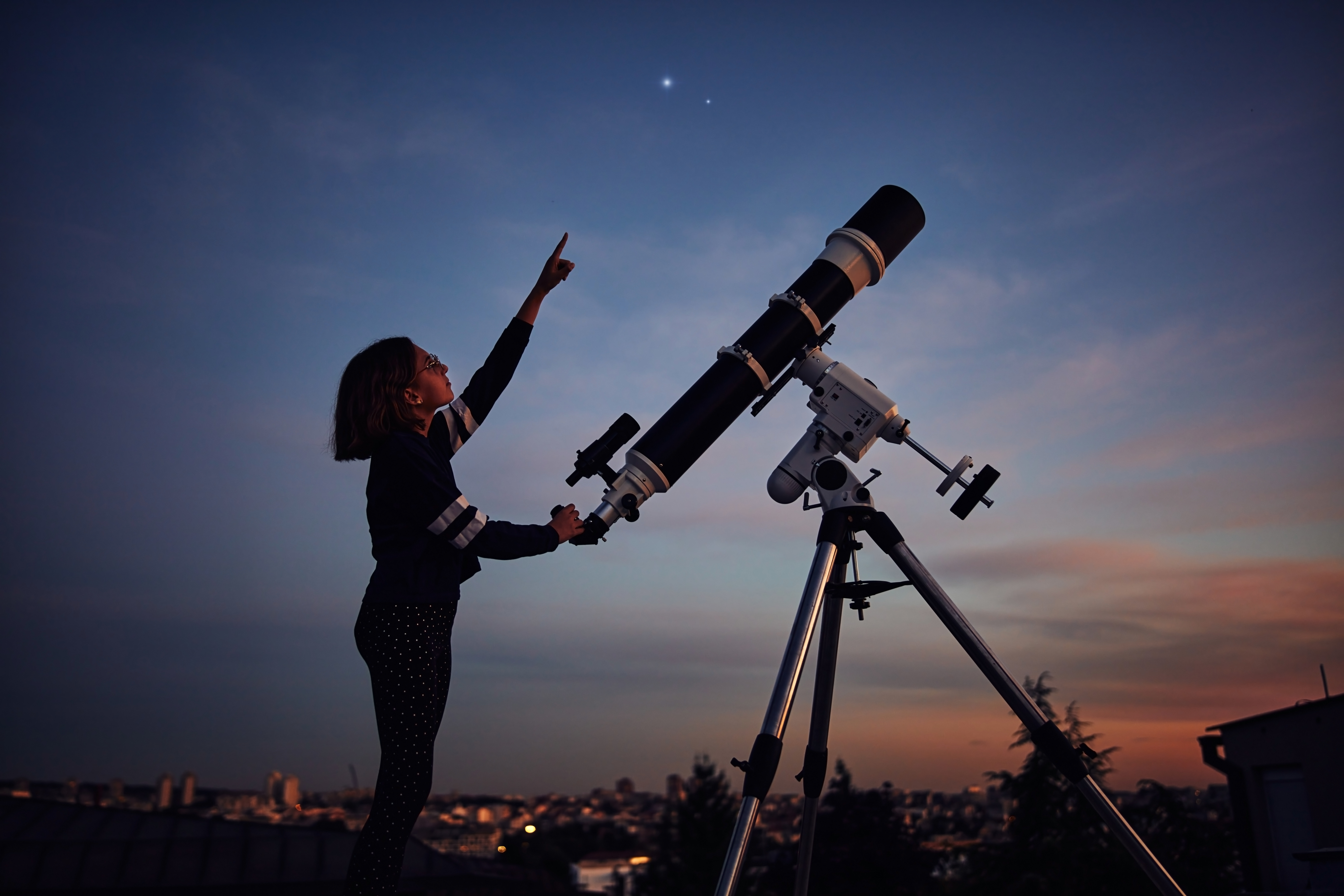 woman using a telescope