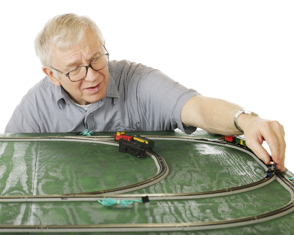 Old man working on model trains