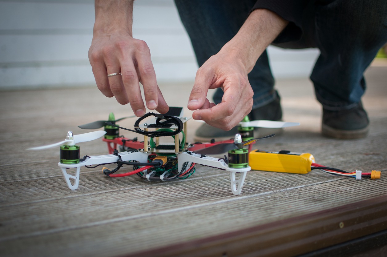 A man working on a DIY drone