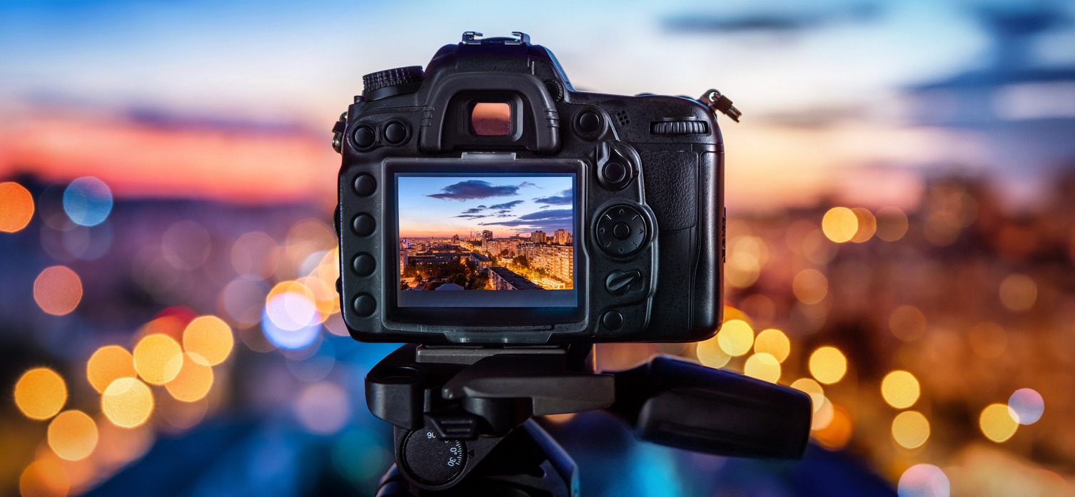 a digital camera set to capture city evening