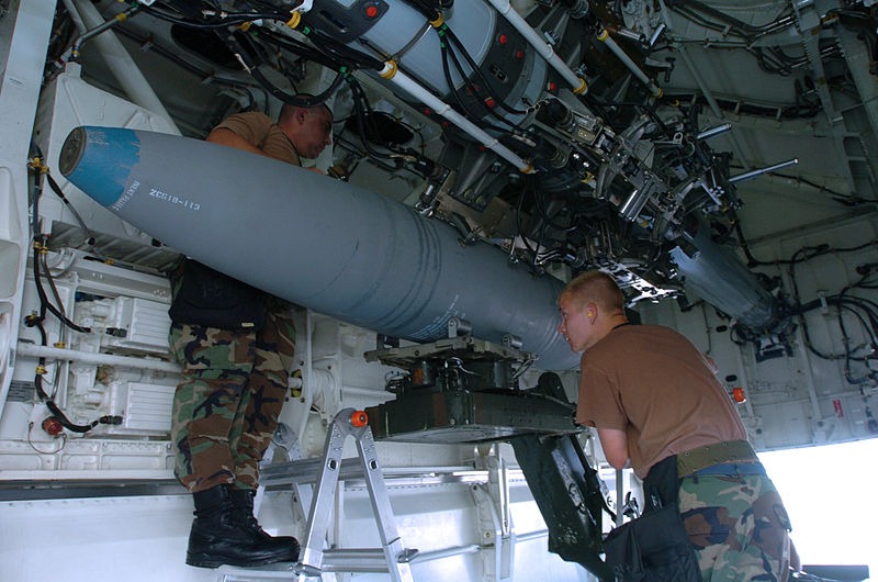 A 2,000 lb (910 kg) BDU-56 bomb being loaded onto a bomb bay's rotary launcher