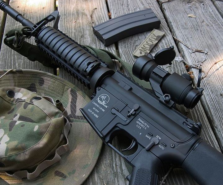 Classic Army M4 AEG with a replica Aimpoint CompM2 red dot sight
