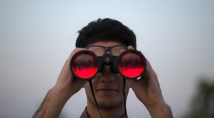 a man using binoculars
