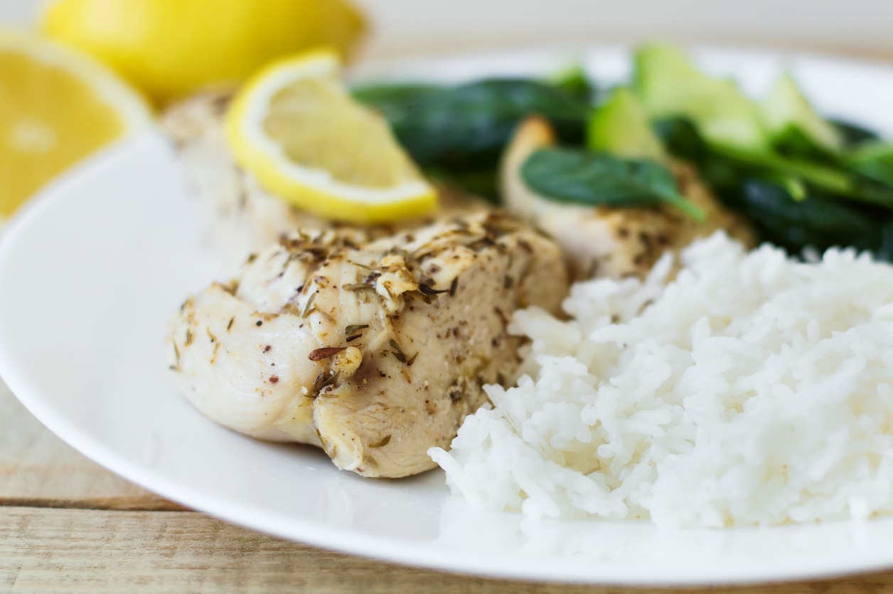 A-plate-of-chicken-breasts-with-thyme-lemon-rice-and-spinach-salad