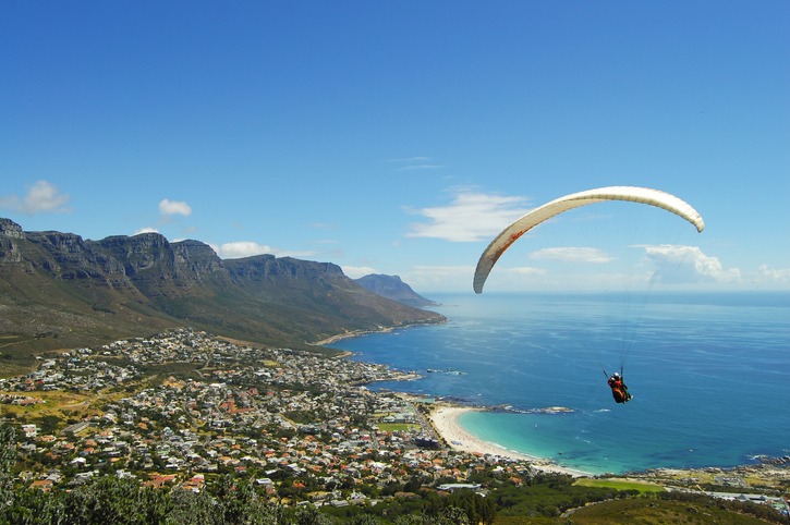 An aerial view of a paraglider above Cape Town, South Africa