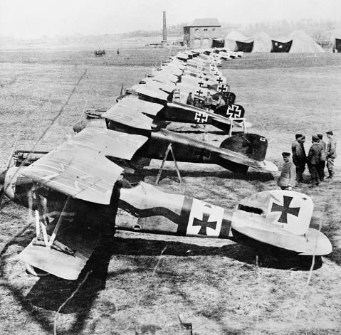 German Albatros D.IIIs of Jagdstaffel 11 and Jagdstaffel 4 parked in a line at La Brayelle near Douai, France. Manfred von Richthofen's red-painted aircraft is second in line (with boarding step ladder in place)