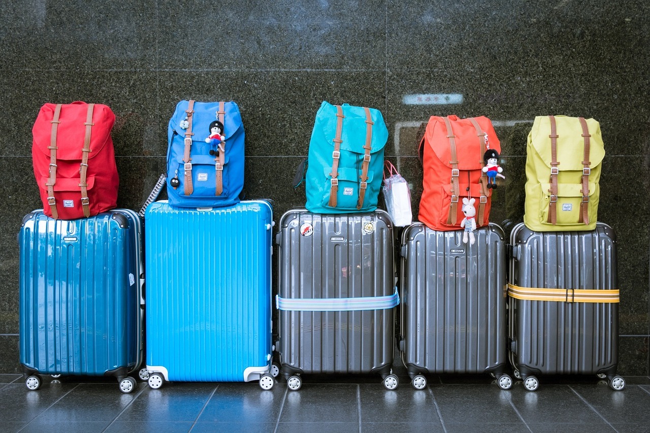 Several brightly-colored pieces of luggage