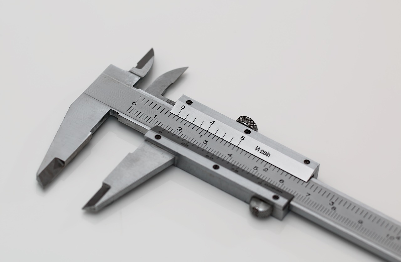 Vernier calipers and steel measuring tape scattered