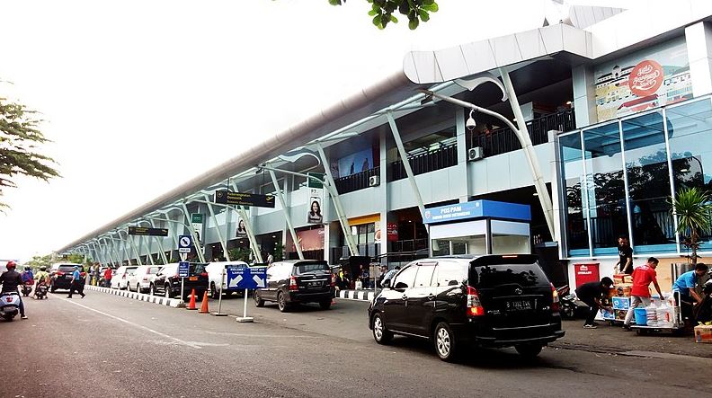 front view of the Husein Sastranegara Airport, people and vehicles passing by