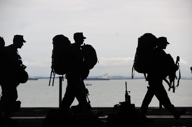 silhouette of soldiers walking