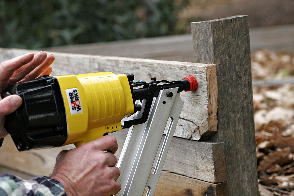 A brad nailer is a powerful tool that uses pressurized air or a battery to drive nails into materials such as wood or metal without requiring any manual effort on your side