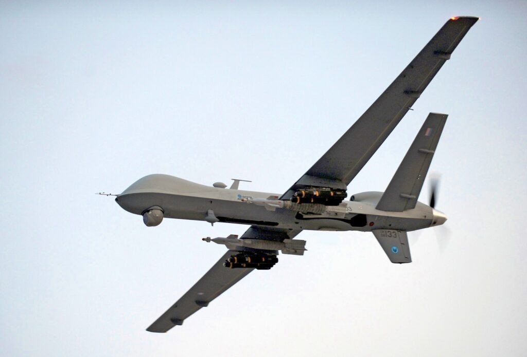 How are military drones powered and how long can they fly