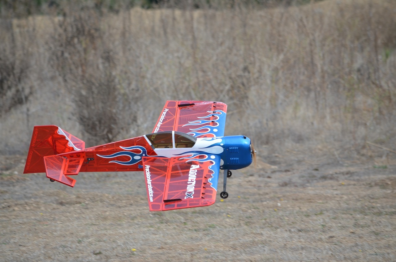 red RC plane with blue flames