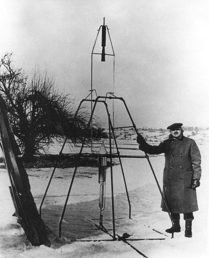 A-photo-of-Robert-Goddard-and-his-first-liquid-fueled-rocket