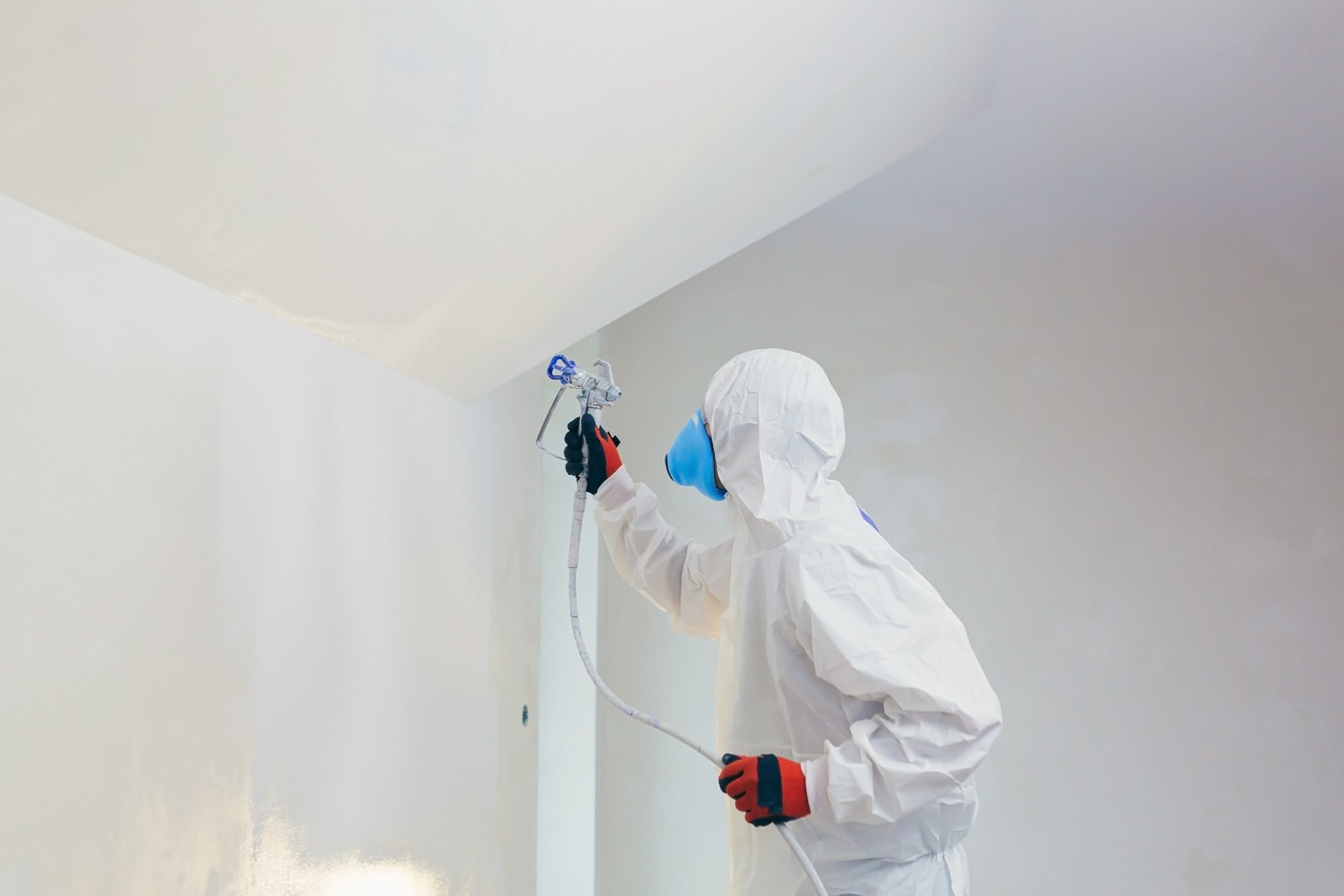 a-man-spraying-the-wall-with-airless-spray