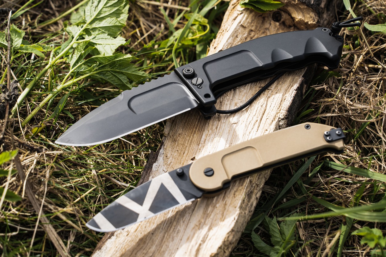 Adventure, Black Color, Blade, Camouflage, Camping, Close-Up, Color Image, Day, Equipment, Estonia, Firewood, Folding, Grass, Handle, Horizontal, Hunting – Sport, Knife – Weapon, Military