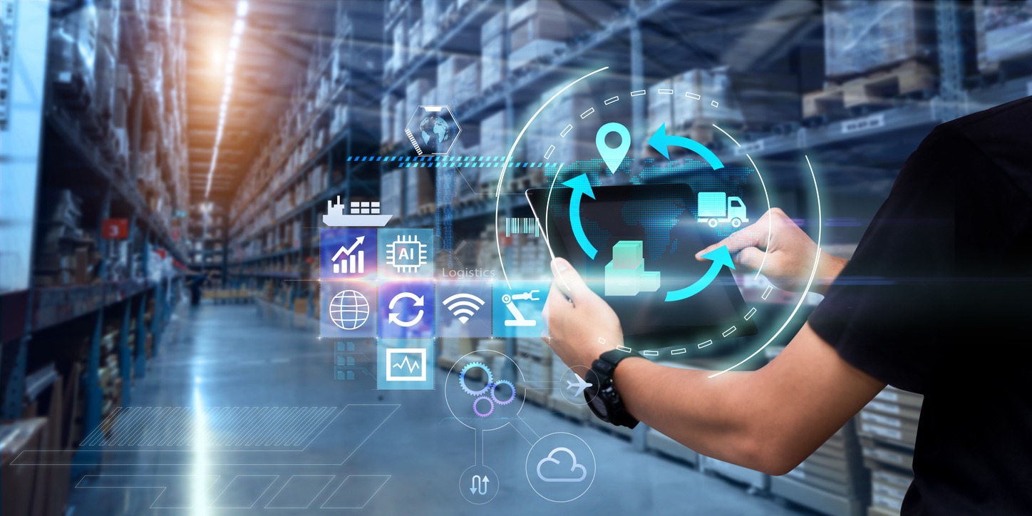 Man hands using tablet on blurred warehouse as background, featuring concept of IoT for business logistics application