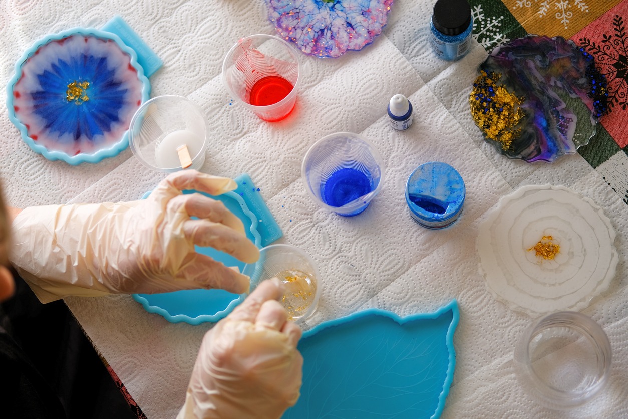 Woman making epoxy resin arts and crafts