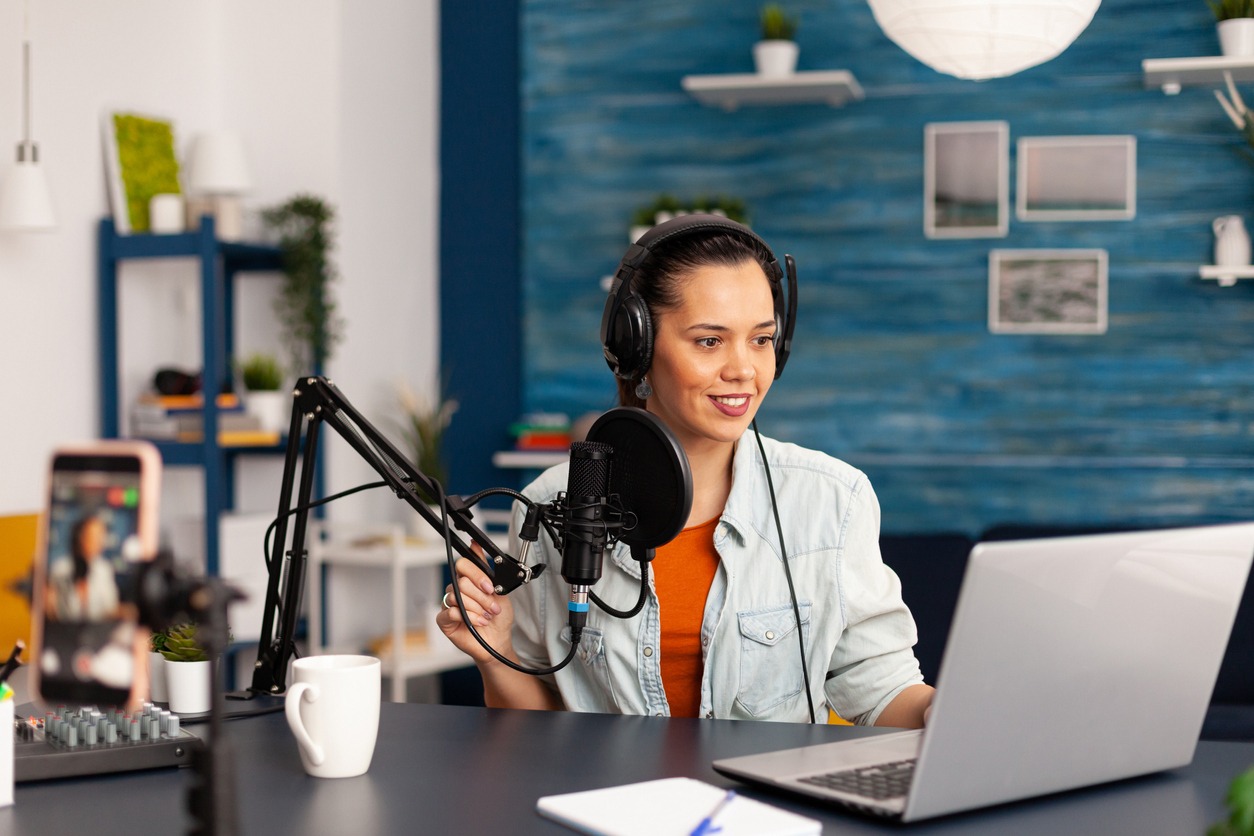 a businesswoman recording a podcast