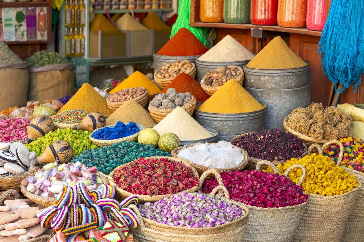 a market in Marrakesh selling colorful spices and dyes