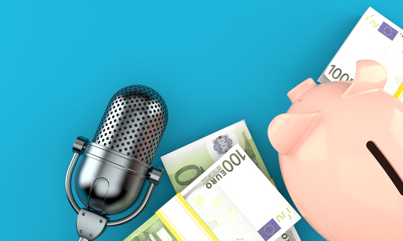 a radio microphone with a piggy bank and some Euro bills
