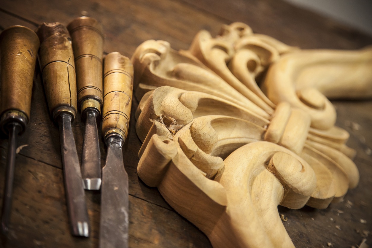 a set of chisels beside a wood carving product