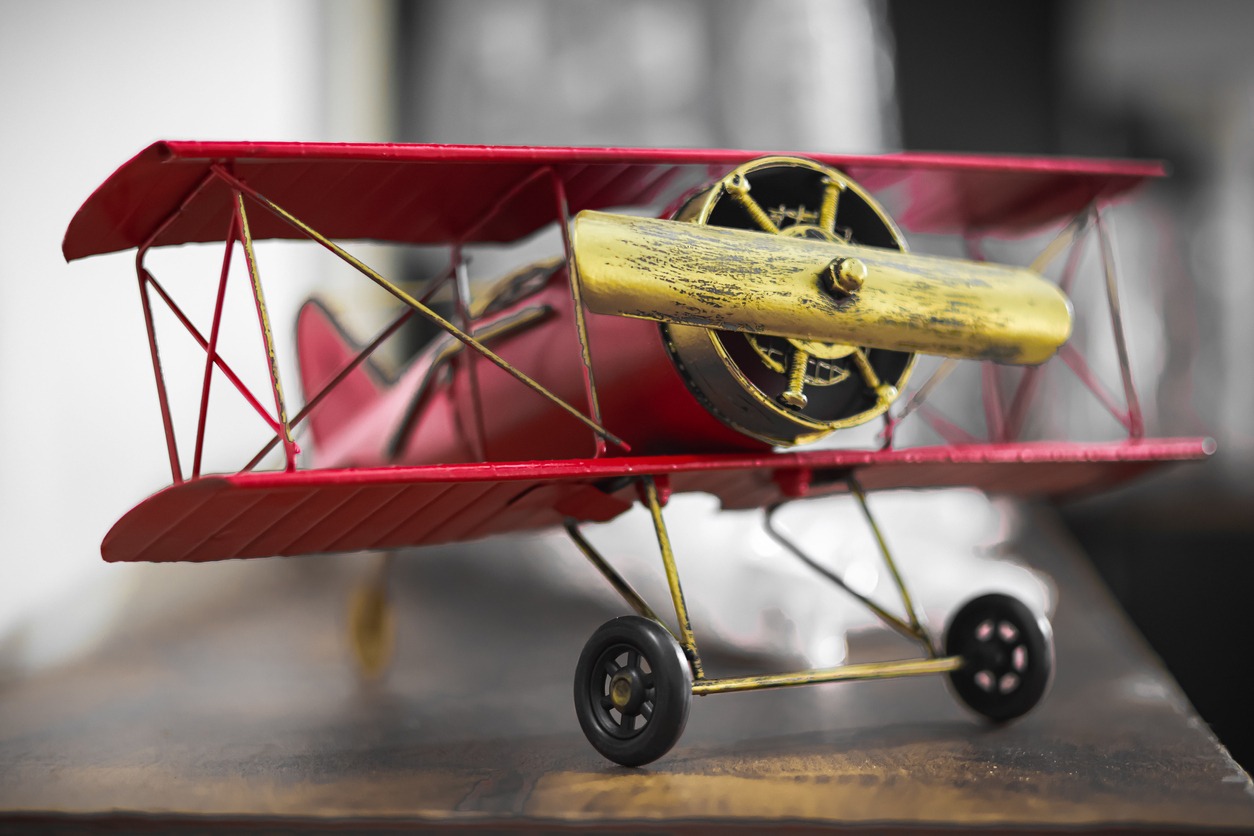 a small-scale model of a red airplane