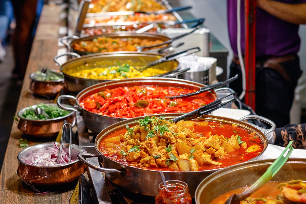 a variety of curries served on a buffet