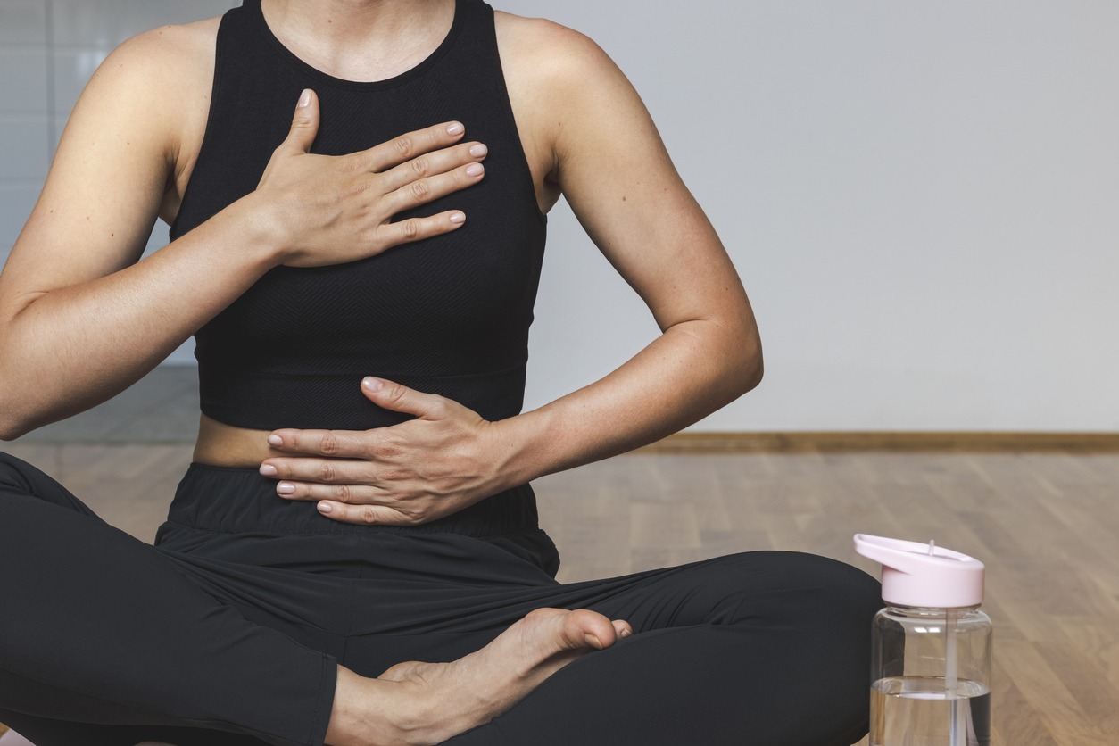 a woman doing breathing exercises