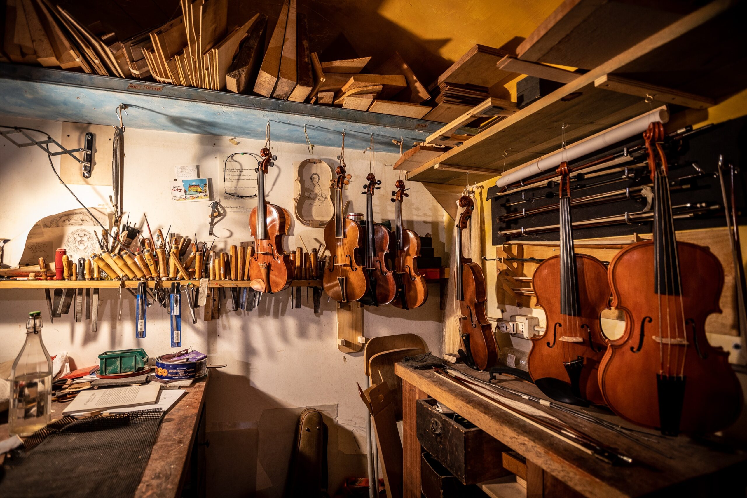 a-room-with-many-guitars-on-the-wall