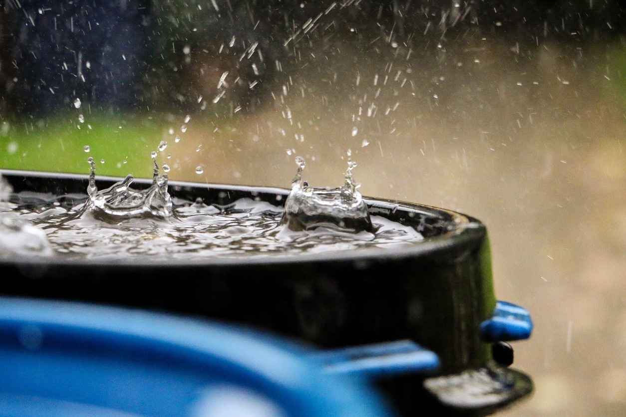 hard-rain-is-falling-in-a-plastic-barrel-full-of-water-in-the-garden