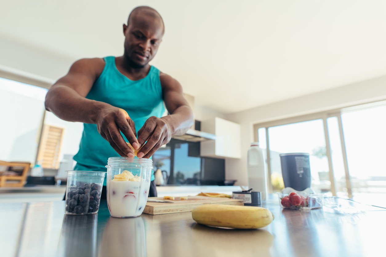 man-preparing-breakfast-in-kitchen