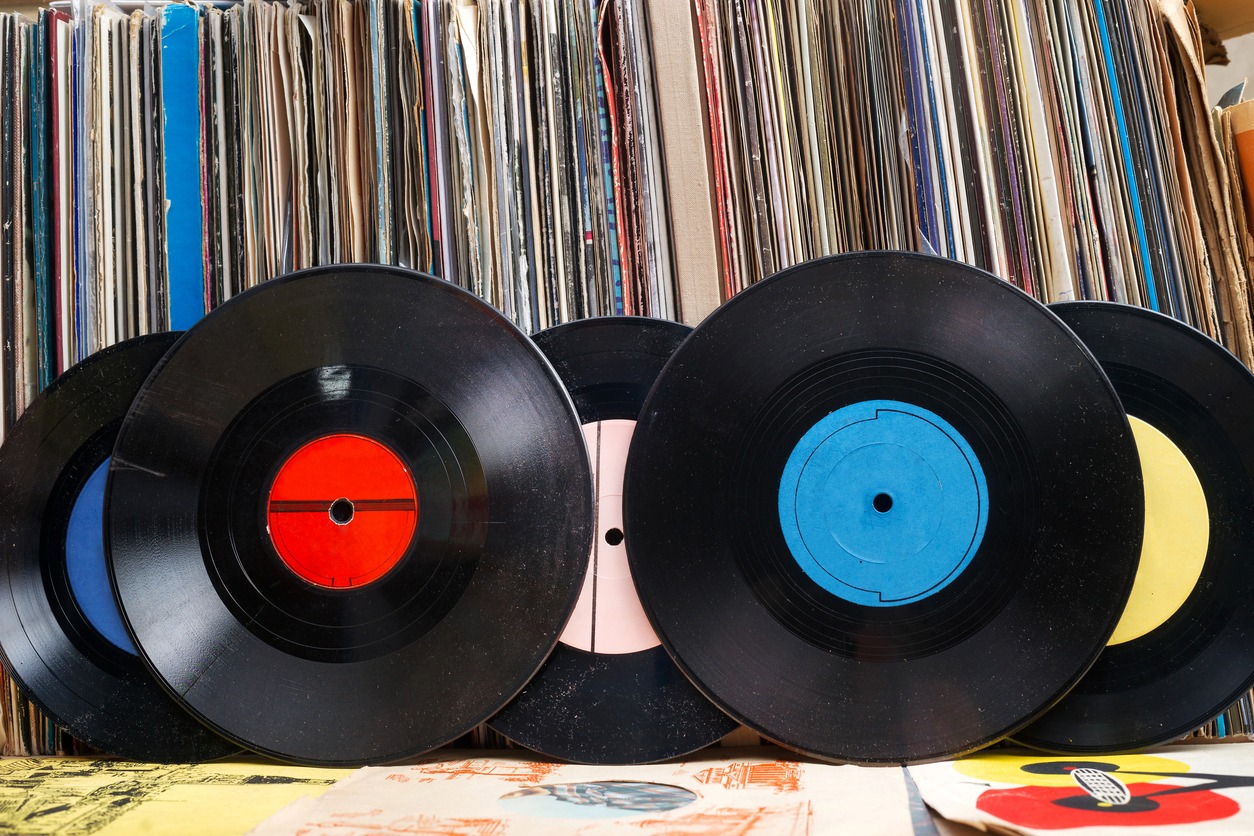 Vinyl record with copy space in front of a collection
