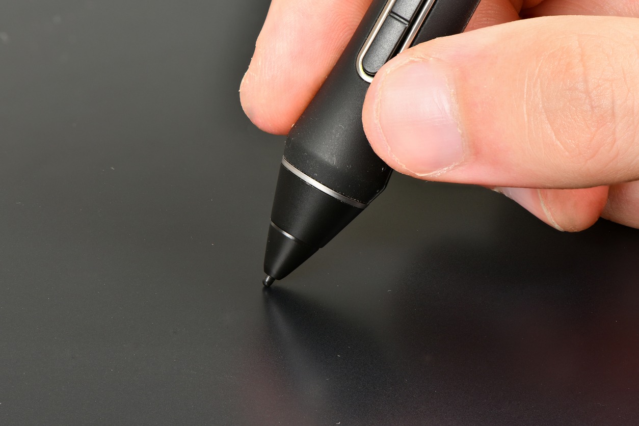 Hand of the designer with pen