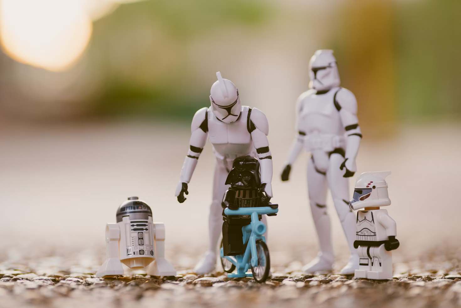 Selective focus photography of star wars stormtropper r2 d2 and darth vader toys